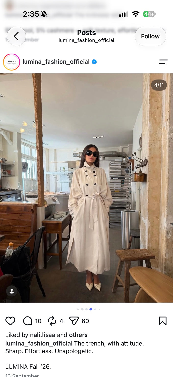 Cream belted trench coat front view