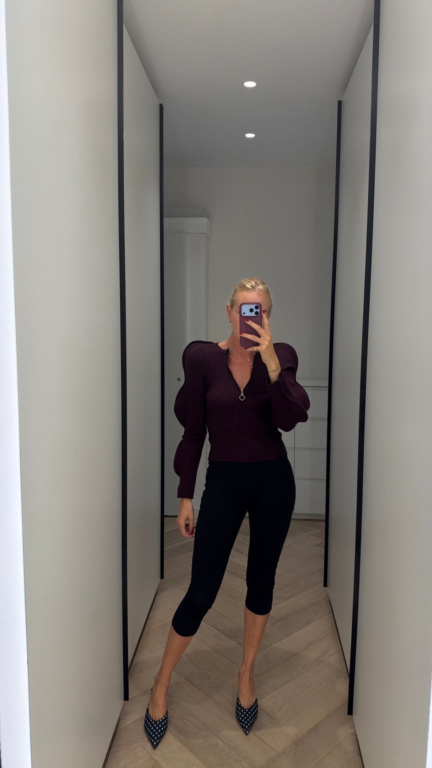 Burgundy ribbed zip-neck knit with puff sleeves