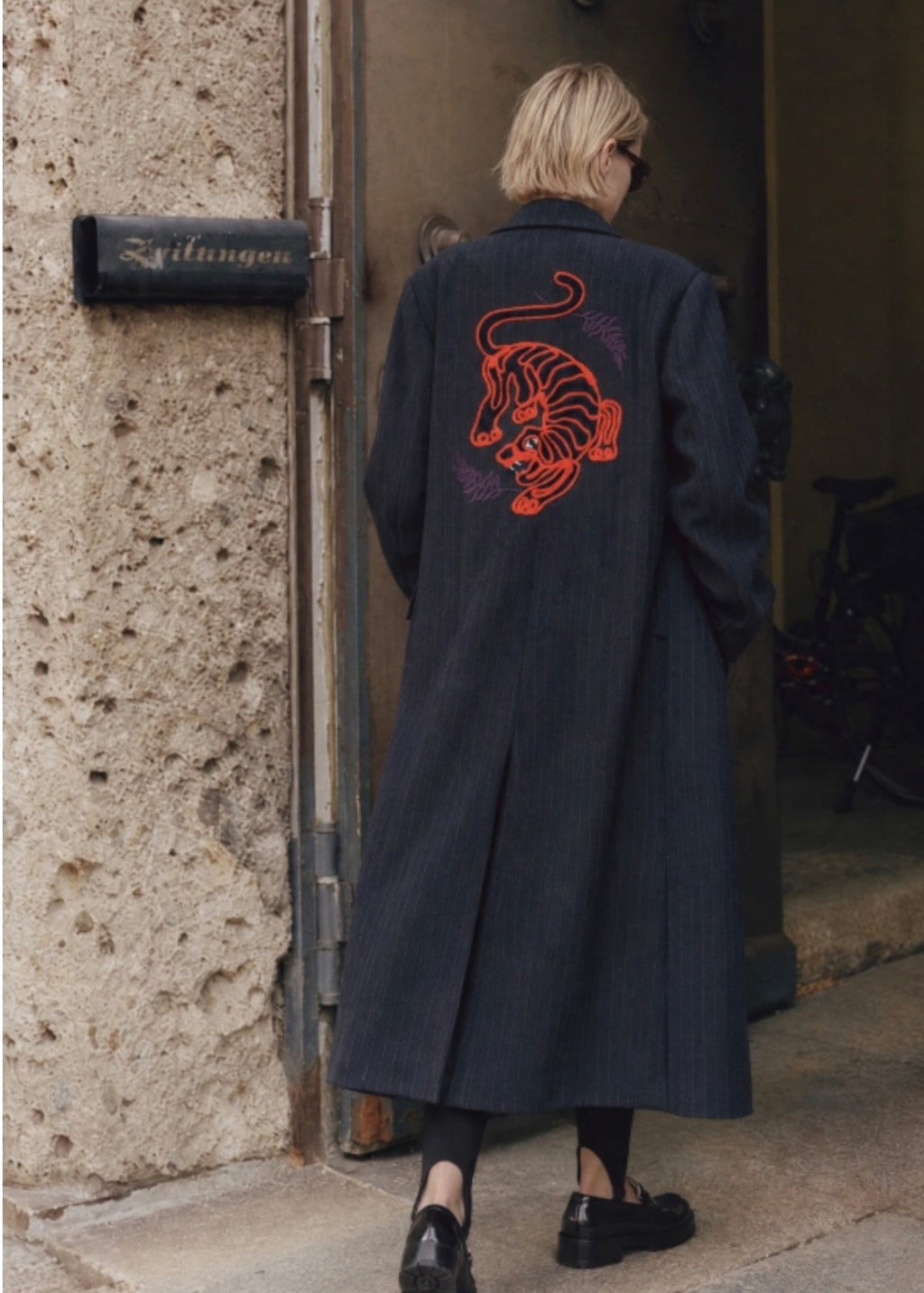 Raya navy blue pinstripe coat with tiger embroidery