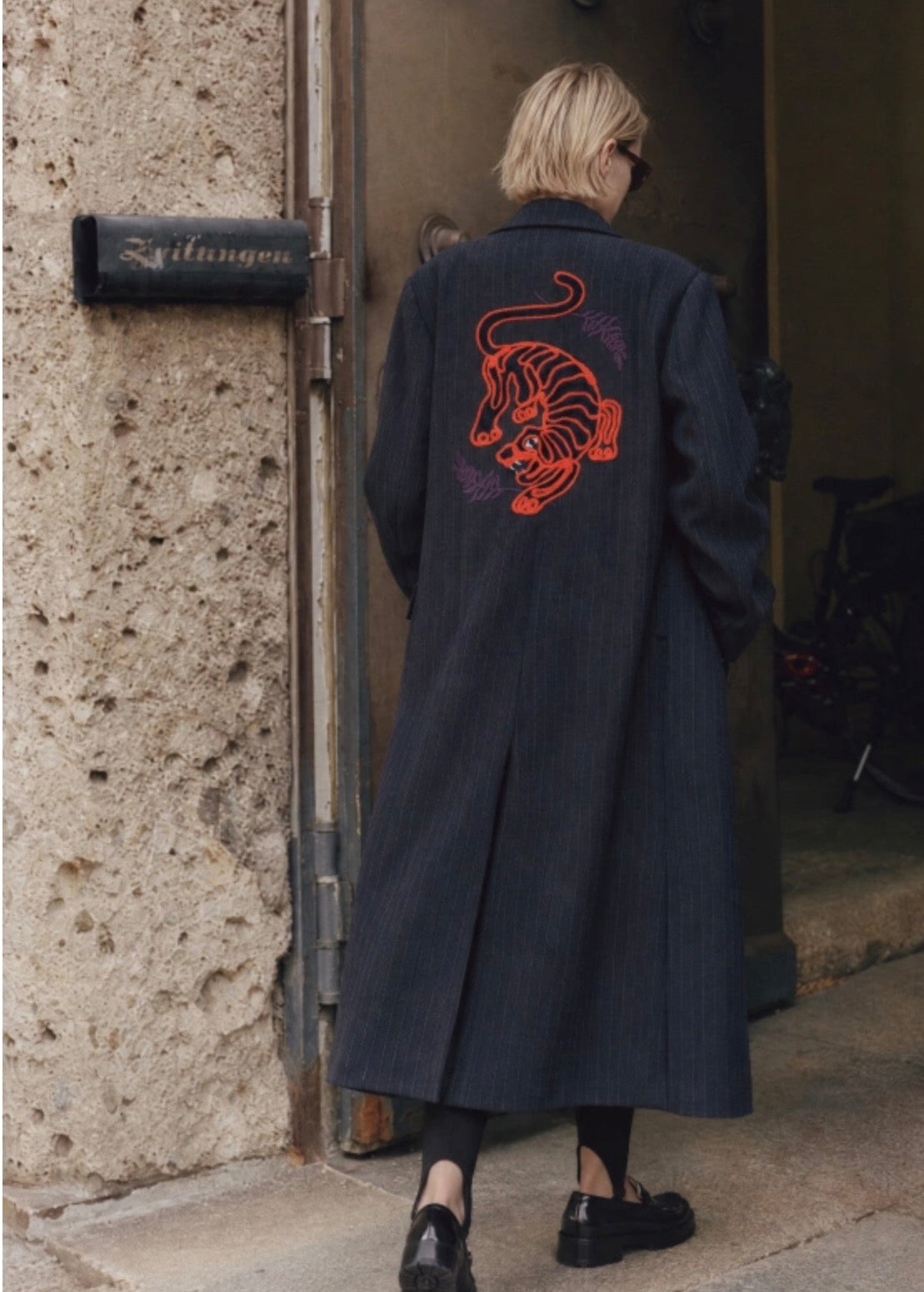 Raya navy blue pinstripe coat with tiger embroidery