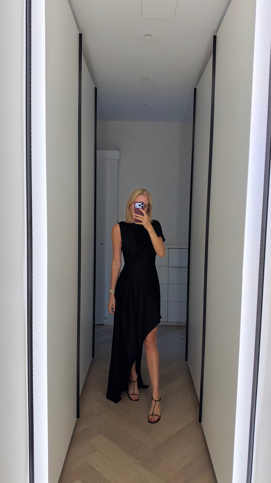 Black asymmetric draped maxi dress on model