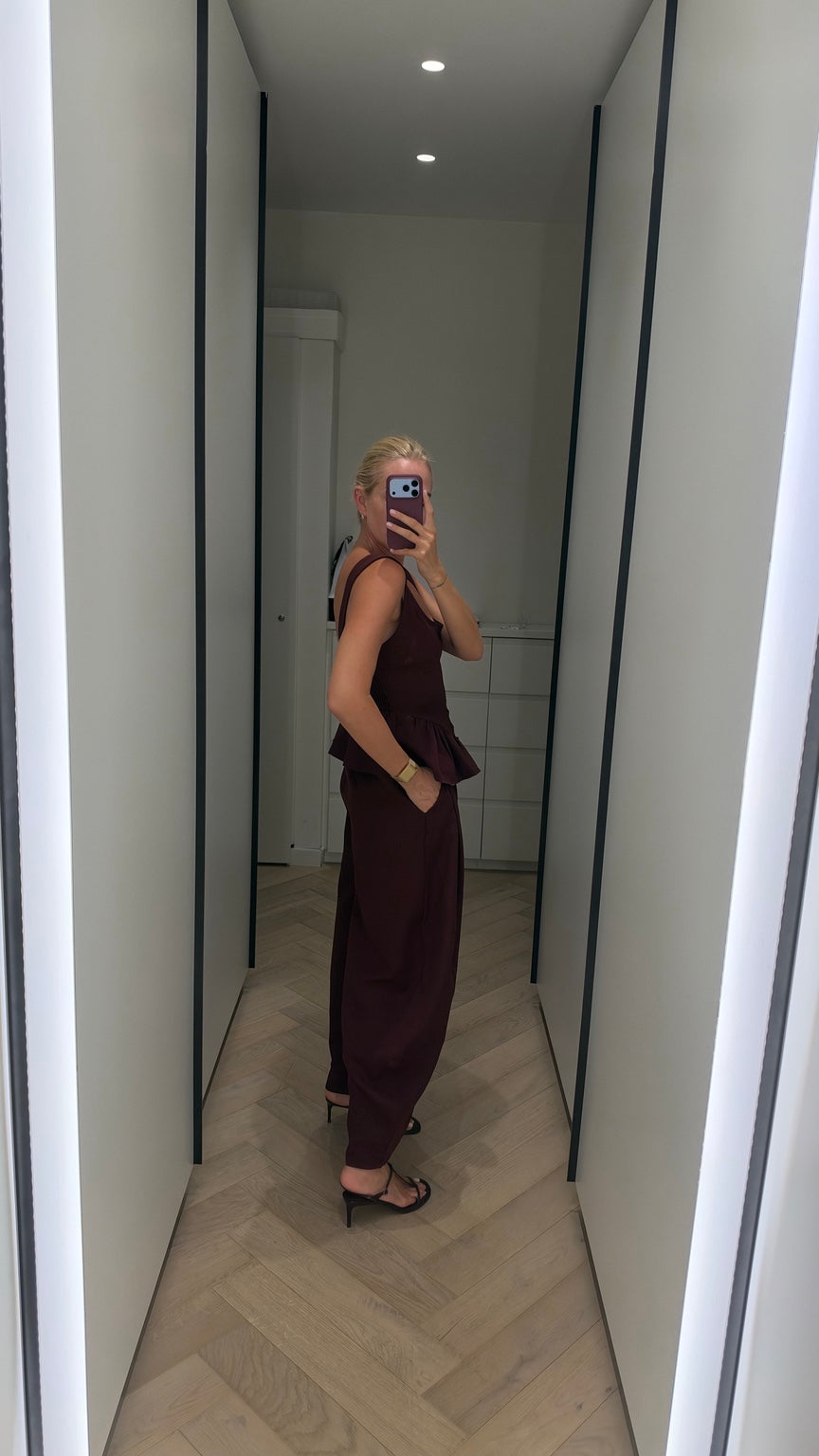 Burgundy peplum top and wide-leg trouser set side view