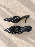 Black and white polka dot pointed heel mules
