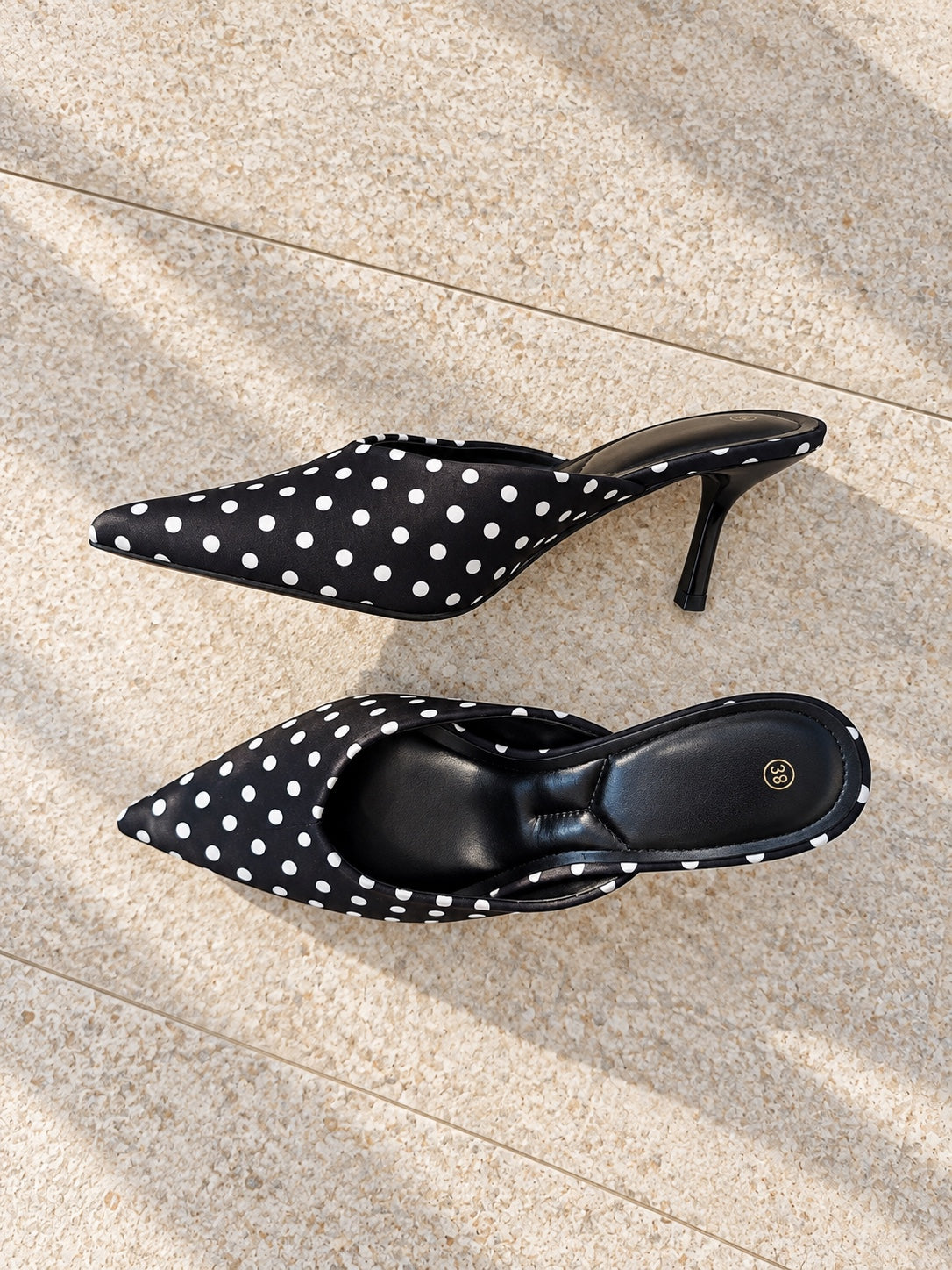 Black and white polka dot pointed heel mules